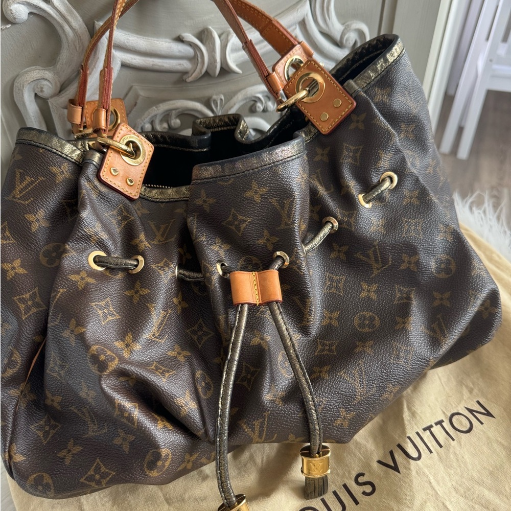 LOUIS VUITTON “IRENE” MONOGRAM, METALLIC TRIM, DRAWSTRING BAG, RARE